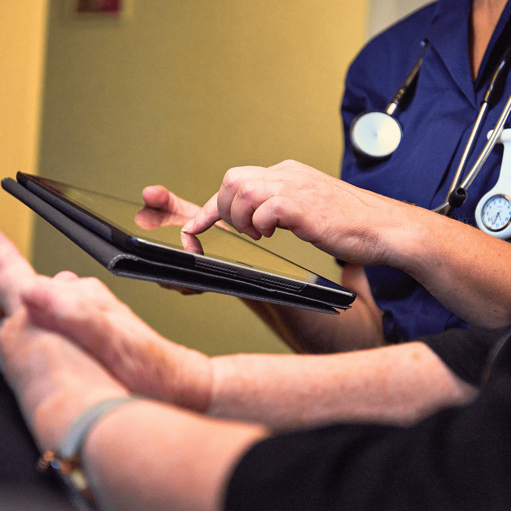 Nurse and patient using ipad