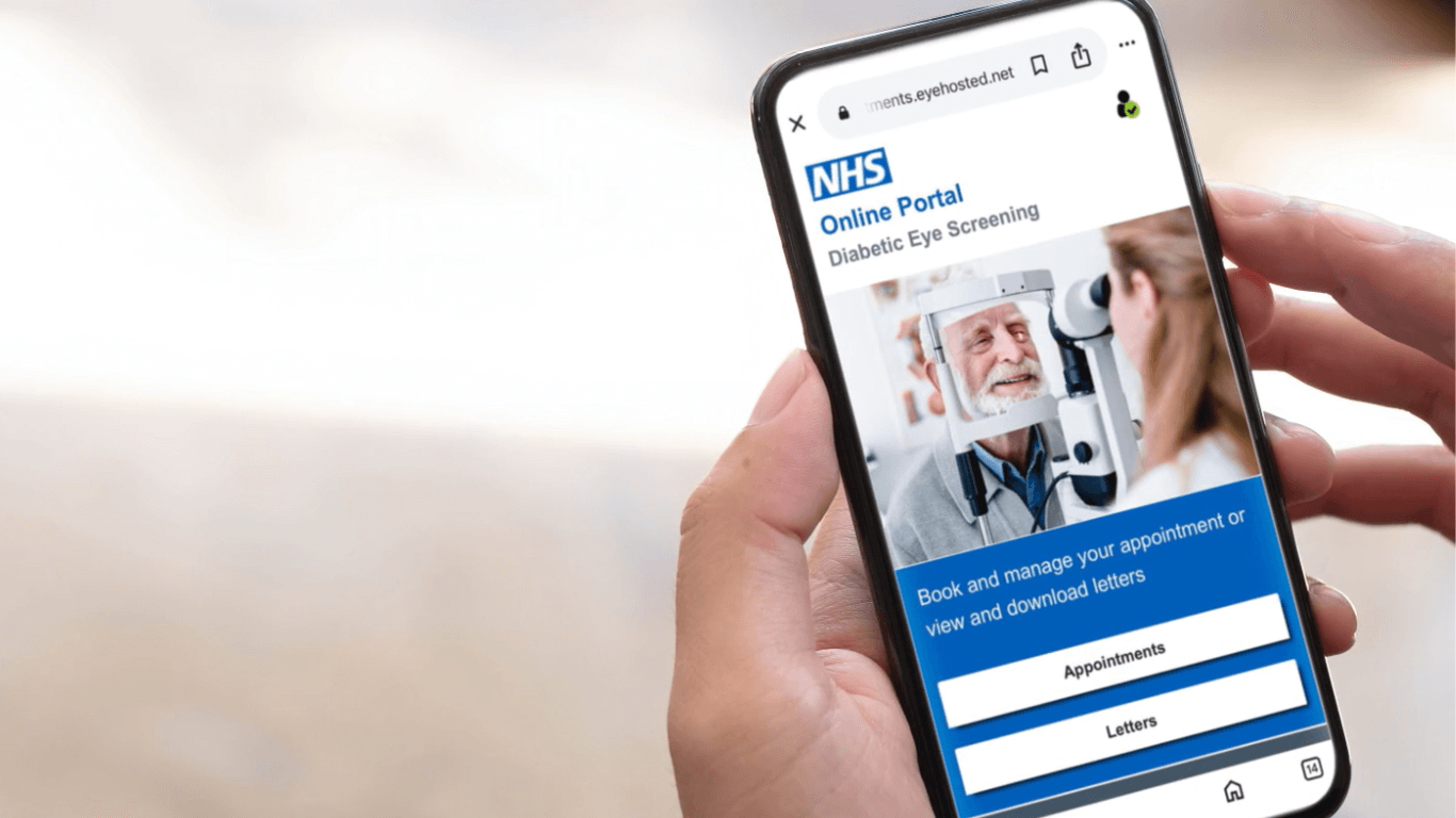 A close up view of a persons hands holding a mobile phone while they are logged into the OptoMize Online Portal